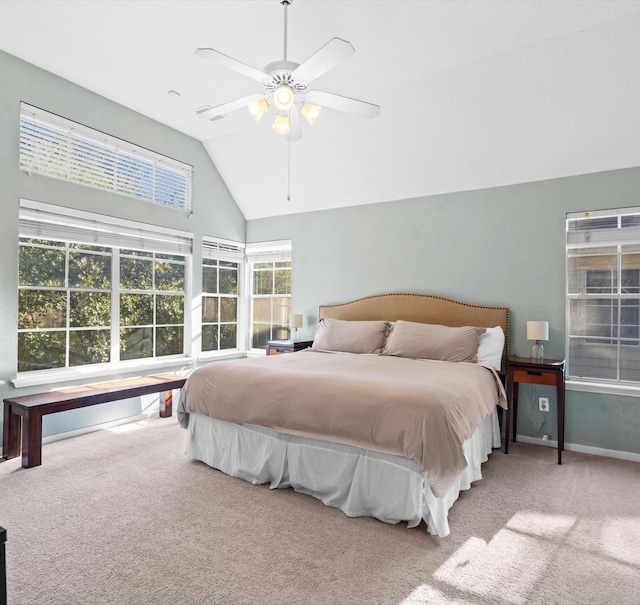 carpeted bedroom featuring ceiling fan and vaulted ceiling