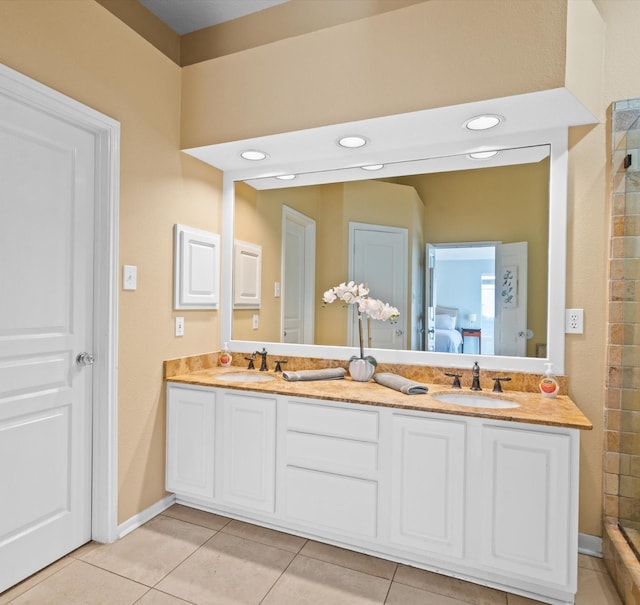 bathroom featuring tile patterned flooring and vanity