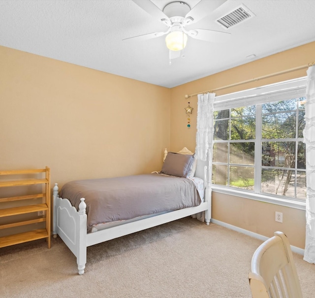 bedroom with ceiling fan and carpet floors