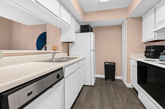 kitchen with a textured ceiling, sink, white cabinets, and white appliances