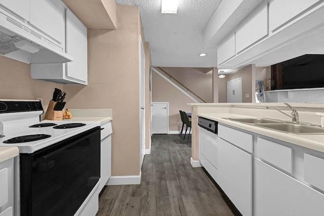 kitchen featuring white appliances, ventilation hood, white cabinetry, and sink