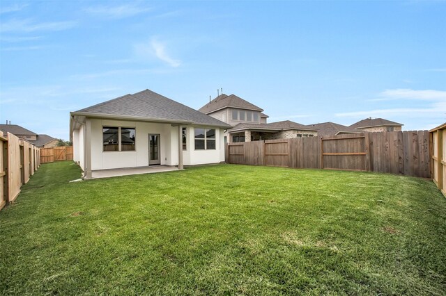 4030 Colony Ln, Missouri City, TX 77459 - back of property with a patio area and a shingled roof