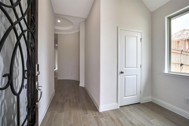 4030 Colony Ln, Missouri City, TX 77459 - hallway with baseboards, wood tiled floors, and lofted ceiling