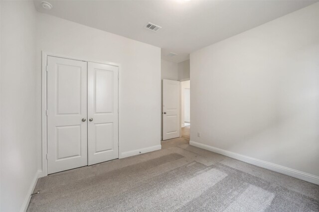 4030 Colony Ln, Missouri City, TX 77459 - unfurnished bedroom featuring carpet, baseboards, and a closet