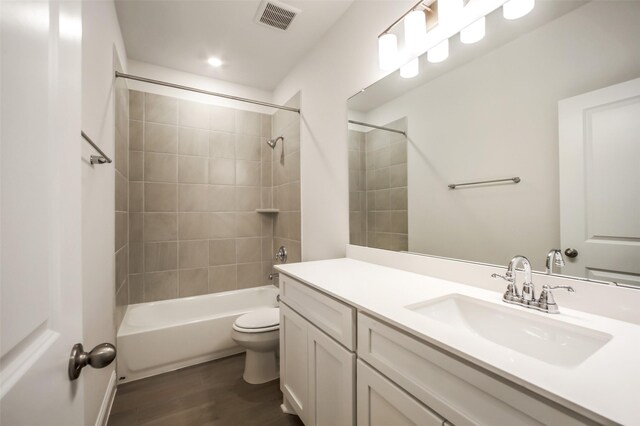 4030 Colony Ln, Missouri City, TX 77459 - full bath with vanity, wood finished floors, toilet, and bathing tub / shower combination