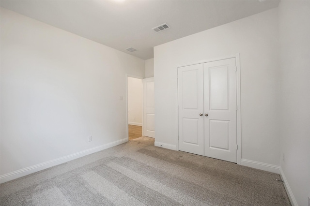 4030 Colony Ln, Missouri City, TX 77459 - unfurnished bedroom with light carpet, baseboards, and a closet