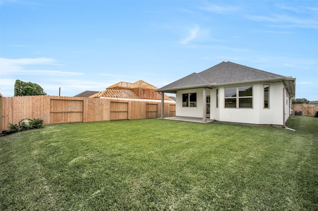 4030 Colony Ln, Missouri City, TX 77459 - back of house with roof with shingles, a patio area, stucco siding, and cooling unit