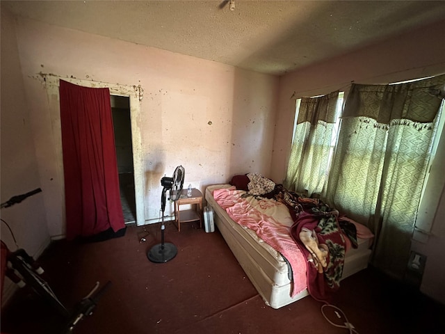 bedroom featuring a textured ceiling