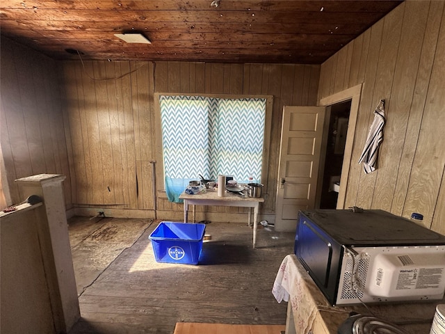 misc room featuring wood walls and wood ceiling