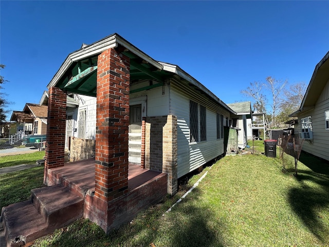 view of home's exterior featuring a lawn and cooling unit