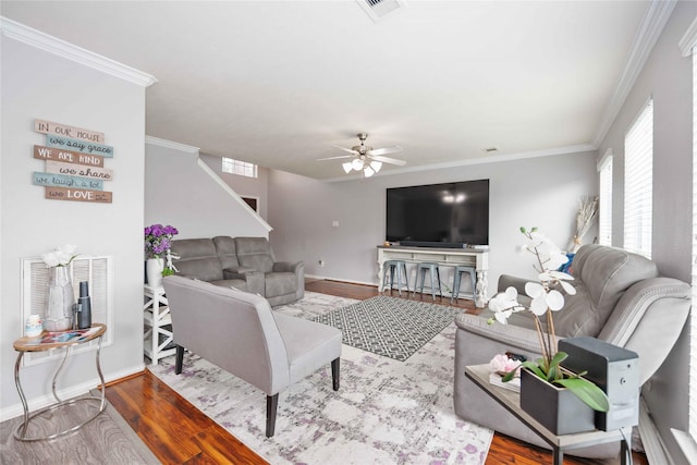 living room with ceiling fan, hardwood / wood-style floors, and ornamental molding