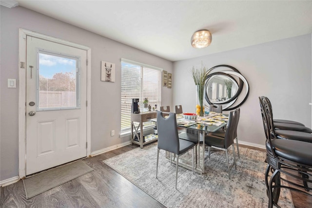 dining space featuring dark hardwood / wood-style floors and a wealth of natural light