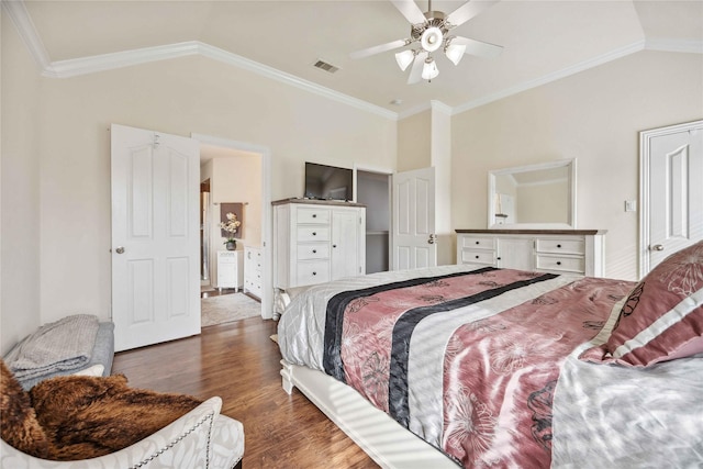 bedroom with ceiling fan, lofted ceiling, and ornamental molding