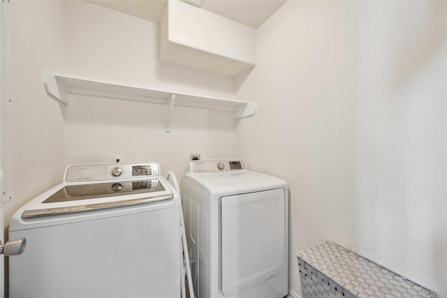 laundry room featuring washer and clothes dryer