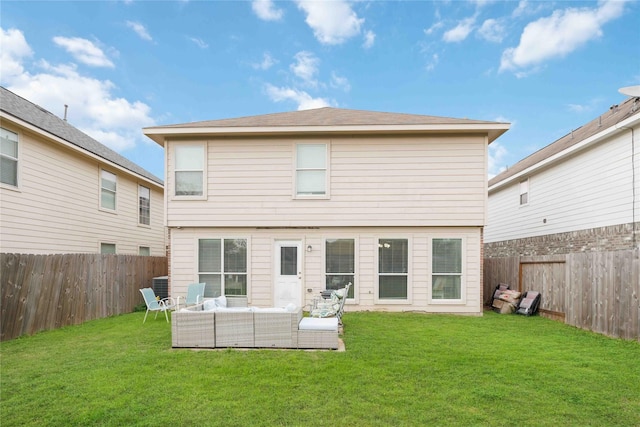 rear view of house featuring a lawn and outdoor lounge area