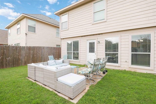 back of property featuring outdoor lounge area and a yard