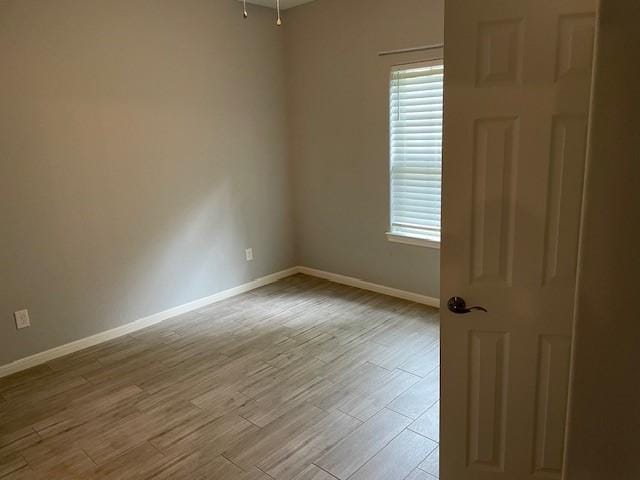 empty room featuring light hardwood / wood-style floors