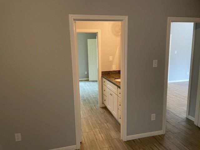 hallway featuring light hardwood / wood-style flooring