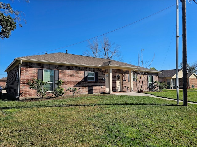 view of front of home with a patio area and a front yard