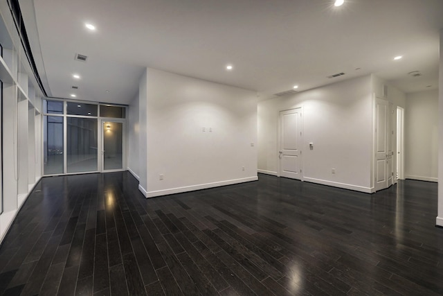 unfurnished room with dark hardwood / wood-style floors