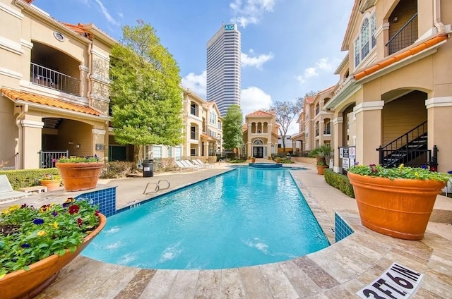 view of pool featuring a patio area and pool water feature