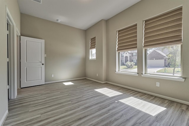 empty room with light wood-type flooring