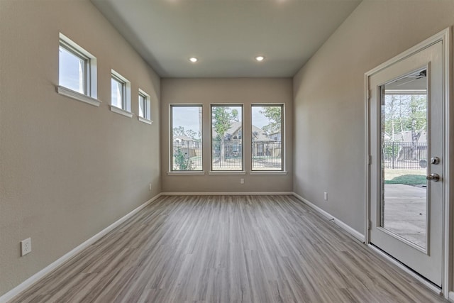 unfurnished room featuring light hardwood / wood-style flooring