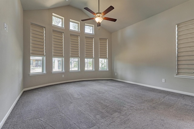 carpeted spare room with vaulted ceiling and ceiling fan