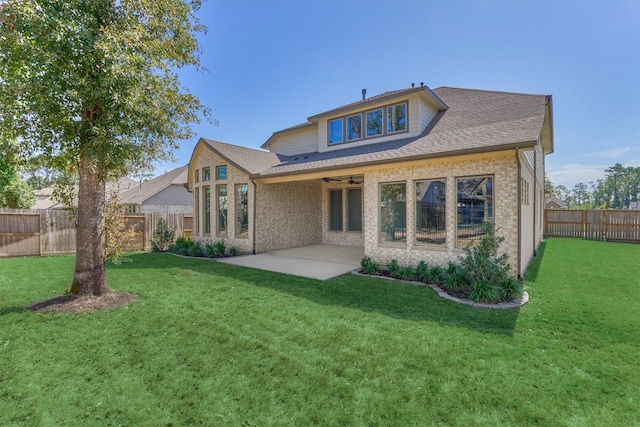 back of house with a lawn, ceiling fan, and a patio area