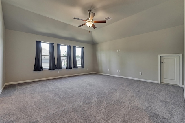 unfurnished room featuring ceiling fan, carpet, and lofted ceiling