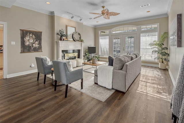 living room featuring french doors, dark hardwood / wood-style flooring, track lighting, and ceiling fan