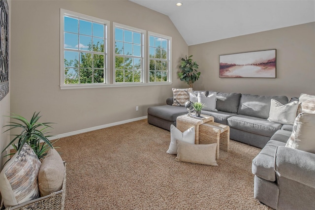 carpeted living room with vaulted ceiling