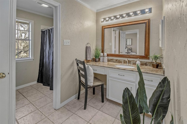 bathroom featuring tile patterned floors, vanity, and crown molding