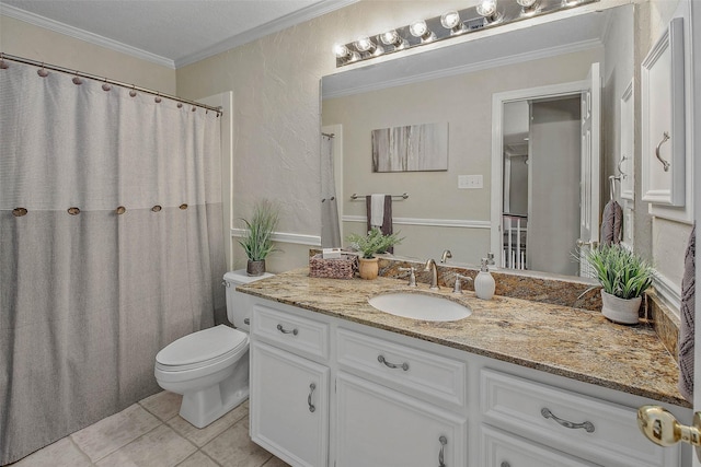 bathroom featuring tile patterned flooring, vanity, toilet, and ornamental molding