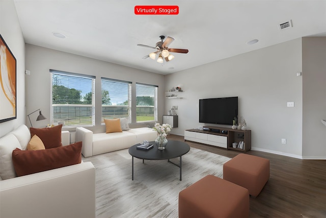 living room with hardwood / wood-style flooring and ceiling fan