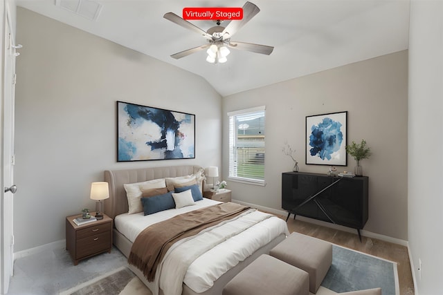 bedroom with ceiling fan and vaulted ceiling