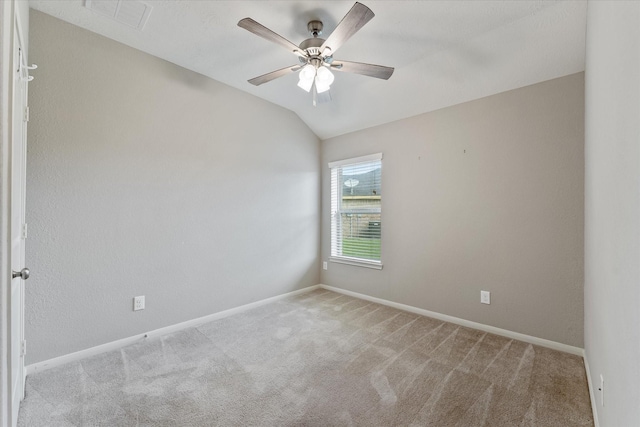 unfurnished room featuring ceiling fan, light colored carpet, and lofted ceiling