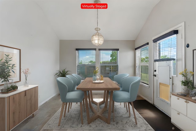 dining room with vaulted ceiling