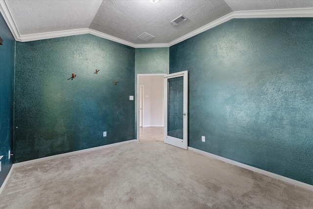 carpeted spare room featuring french doors, lofted ceiling, a textured ceiling, and crown molding