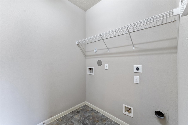 clothes washing area featuring hookup for an electric dryer, hookup for a washing machine, and gas dryer hookup