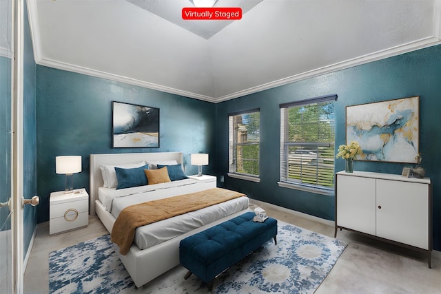 bedroom with lofted ceiling and ornamental molding