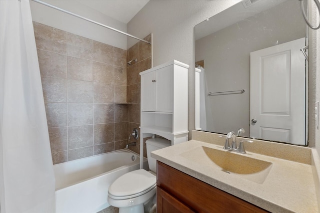 full bathroom featuring vanity, toilet, and shower / tub combo