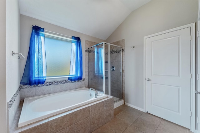 bathroom featuring tile patterned floors, plus walk in shower, and vaulted ceiling