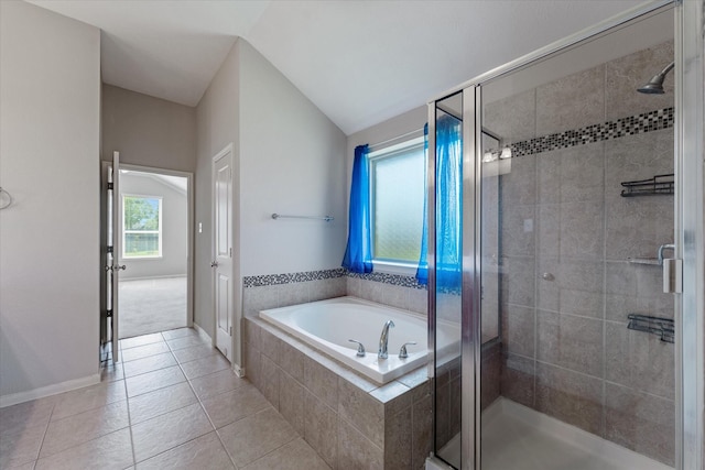 bathroom featuring tile patterned floors, shower with separate bathtub, and vaulted ceiling