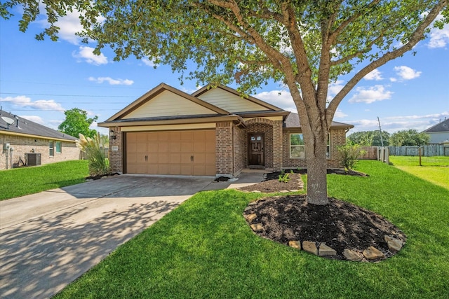 view of front of home featuring central AC, a garage, and a front lawn