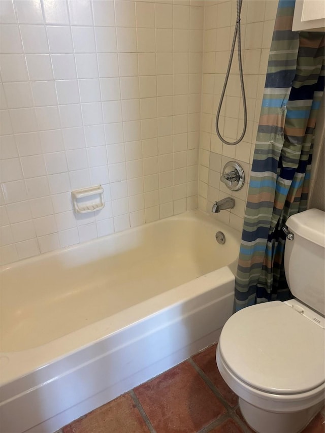 bathroom with tile patterned flooring, shower / tub combo, and toilet