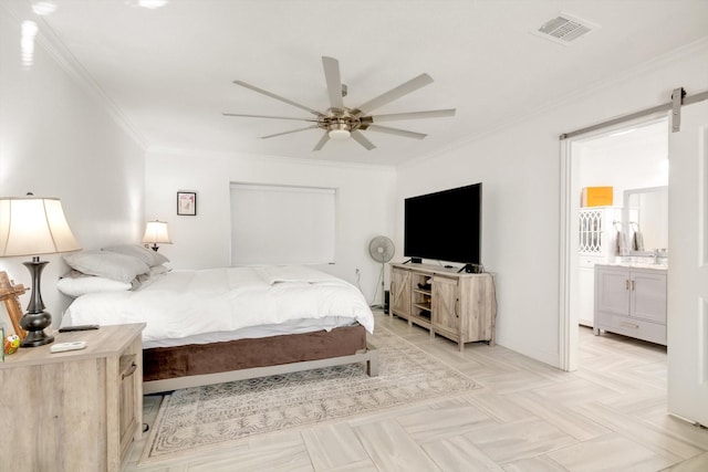 bedroom featuring a barn door, ceiling fan, crown molding, and ensuite bathroom