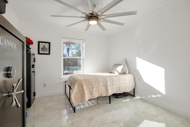 bedroom with ceiling fan and crown molding