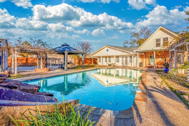 view of pool with a gazebo and a patio area