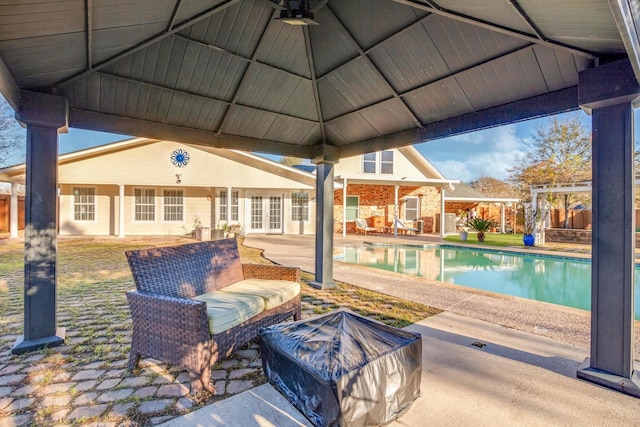 view of swimming pool with a gazebo, french doors, and a patio